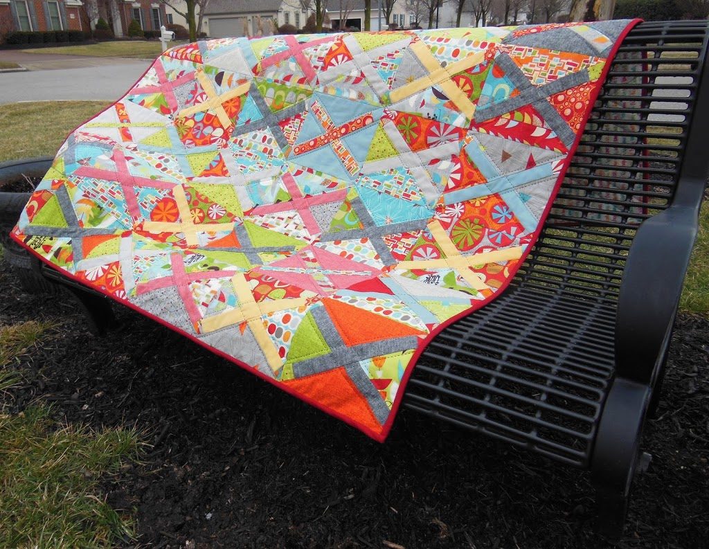 treasure map quilt by sharon mcconnell, modern patchwork cross block with bright colors