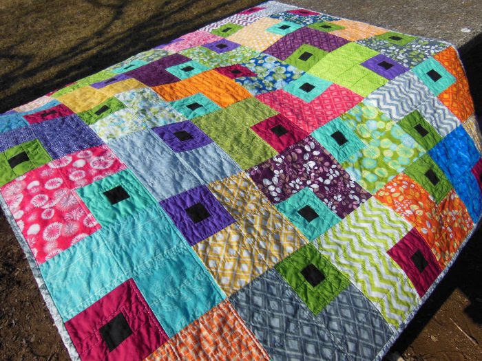 Jewel Box quilt by Color Girl, modern quilting with layer cake fabric