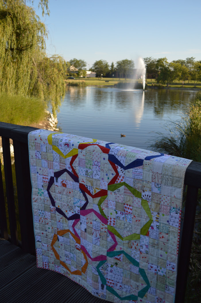 Modern ring quilt, patchwork, low volume pieced quilt with bright color solid fabric rings paper foundation piecing