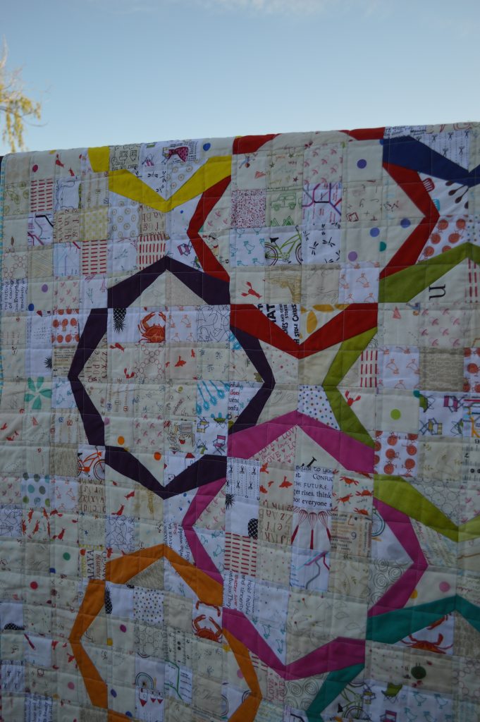 Modern ring quilt, patchwork, low volume pieced quilt with bright color solid fabric rings paper foundation piecing, by sharon mcconnell for color girl quilts