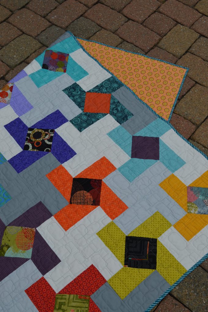 Dutch Windmill Quilt by Sharon McConnell for Color Girl Quilts, modern patchwork, charm quilt