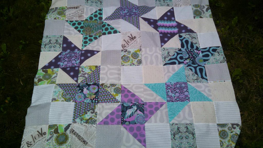 Pinwheel star quilt using tula pink fabric, mini scrappy quilt, modern patchwork