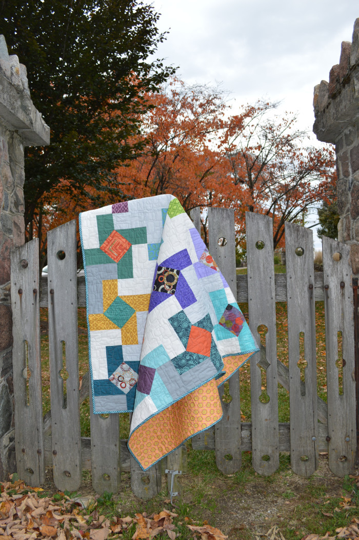 Dutch Windmill quilt by Sharon McConnell, color girl quilts, modern patchwork, pinwheel quilt with scraps