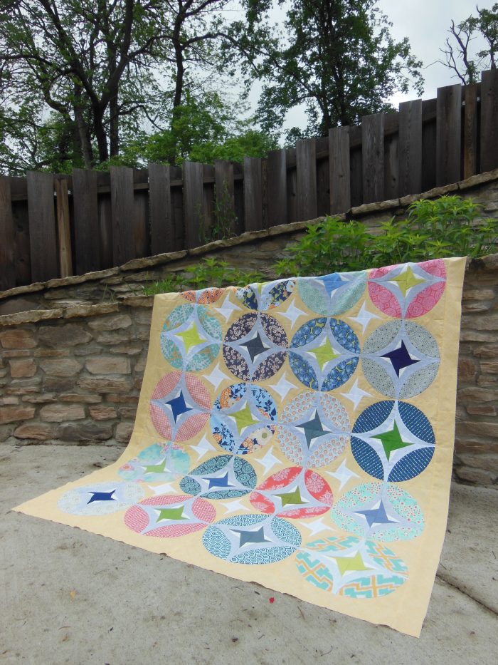 Eclipse quilt by Sharon McConnell, curved piecing orange peel quit design with stars