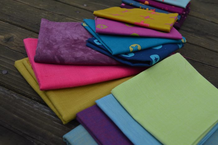 how to mix fabric prints for quilt, handstamped by Alioson Glass with shot cottons and textured solid fabrics