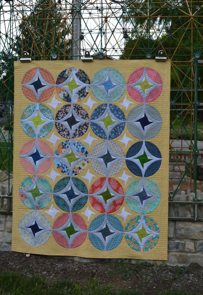Eclipse quilt by Sharon McConnell, curved piecing orange peel quit design with stars