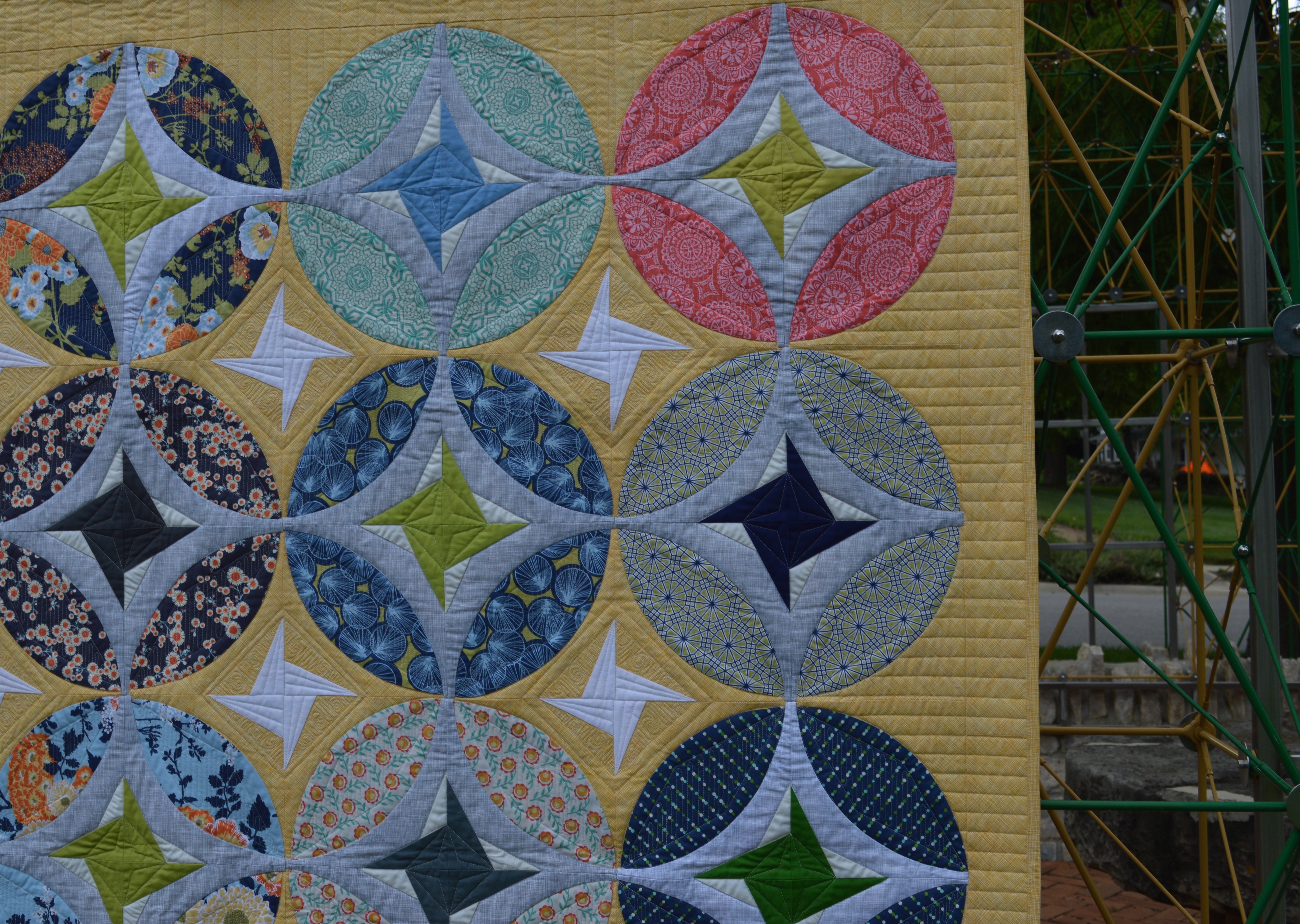 Eclipse quilt by Sharon McConnell, curved piecing orange peel quit design with stars