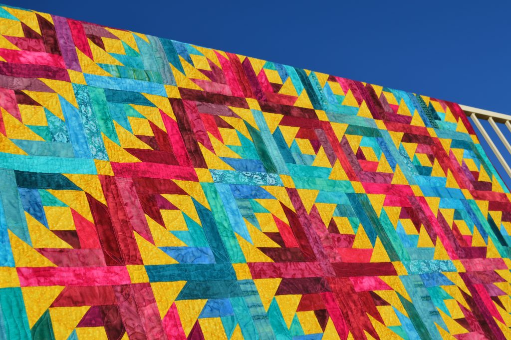 Desert Sunrise Quilt, modern log cabin quilt with batik fabrics by Color Girl Quilts