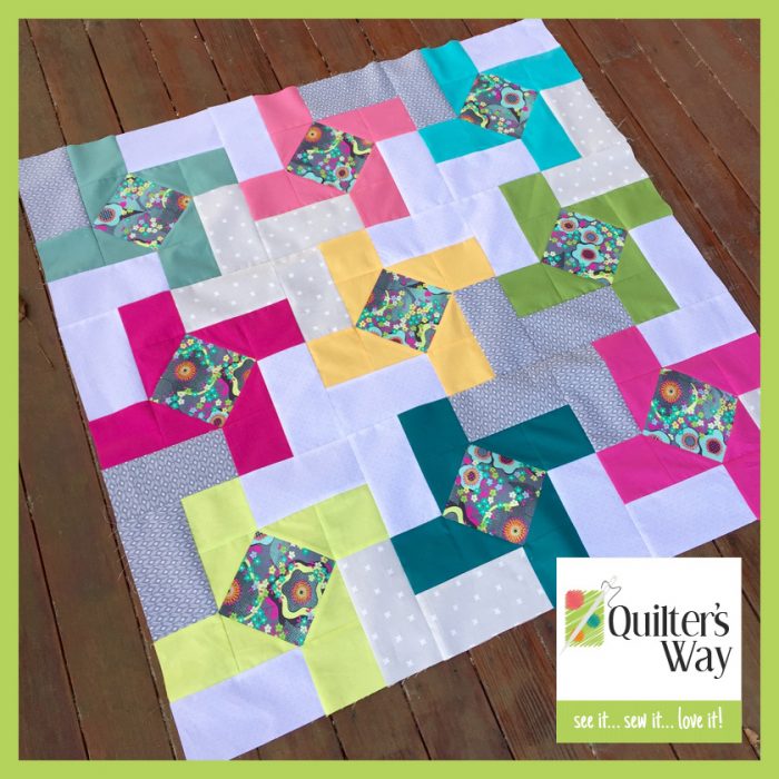 Dutch Windmill modern patchwork baby quilt with solid fabrics and scraps