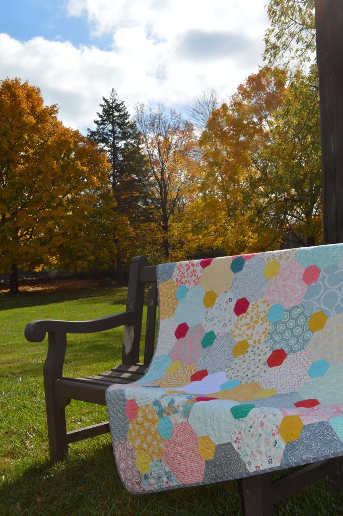 Pops hexagon patchwork quilt by Sharon McConnell, featured in Quilt Now Magazine