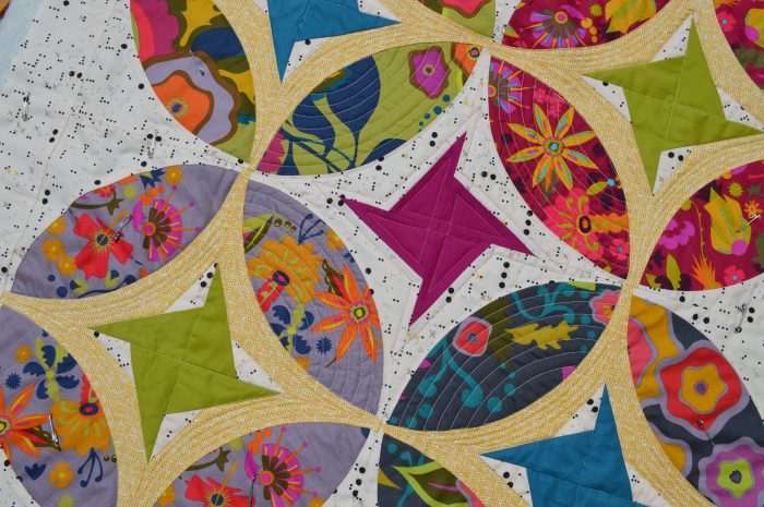 Eclipse quilt, curved piecing mini quilt by Sharon McConnell