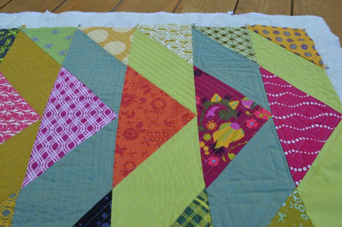 broken v modern triangle patchwork quilt by Sharon McConnell