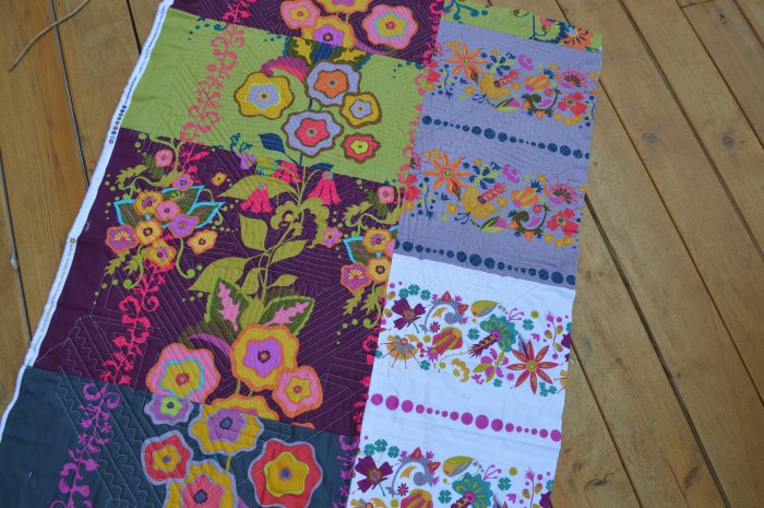 learning to free motion quilt, scrappy quilt back