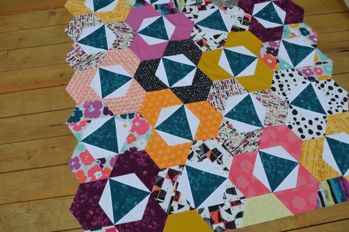 Pieced modern hexagon quilt by Sharon McConnell with Art Gallery Fabrics