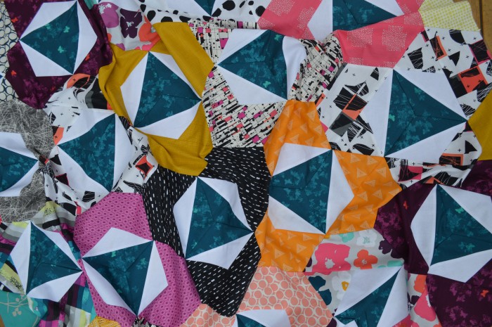 Pieced modern hexagon quilt by Sharon McConnell with Art Gallery Fabrics