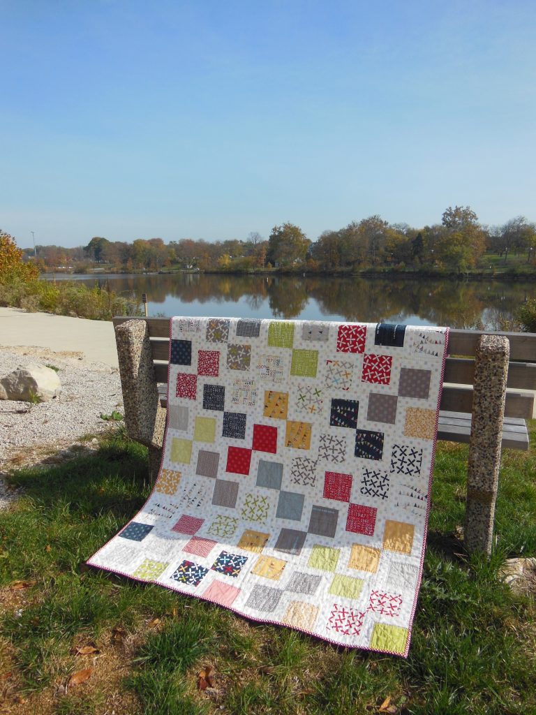 Reflections charm square quilt with fabric by Moda