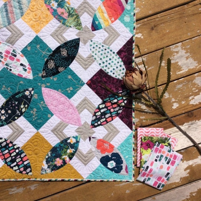 Summer Bloom quilt pattern by Color Girl Sharon McConnell. modern curved piecing quilt with Art Gallery Fabrics