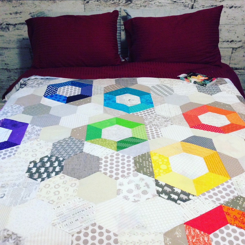 After the rain quilt, hexagon scrappy rainbow quilt by Sharon McConnell