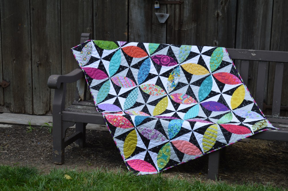 Lava beach quilt by Sharon McConnell, modern curved piecing orange peel quilt