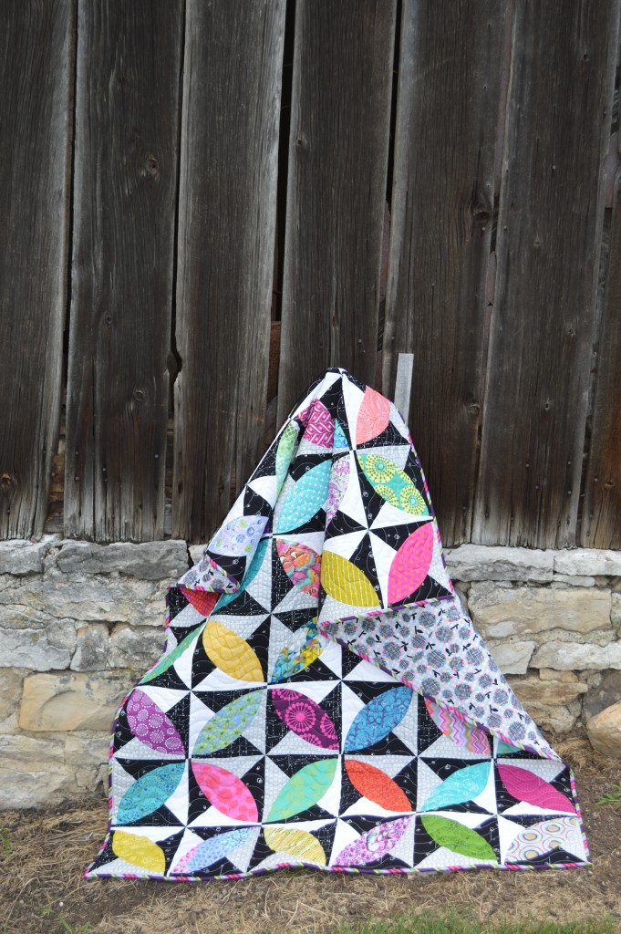 Lava beach quilt by Sharon McConnell, modern curved piecing orange peel quilt