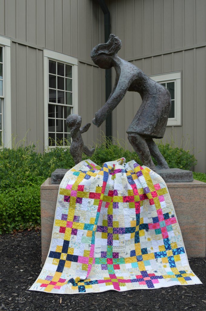 Nine Plus quilt by Sharon McConnell, scrappy modern nine-patch quilt