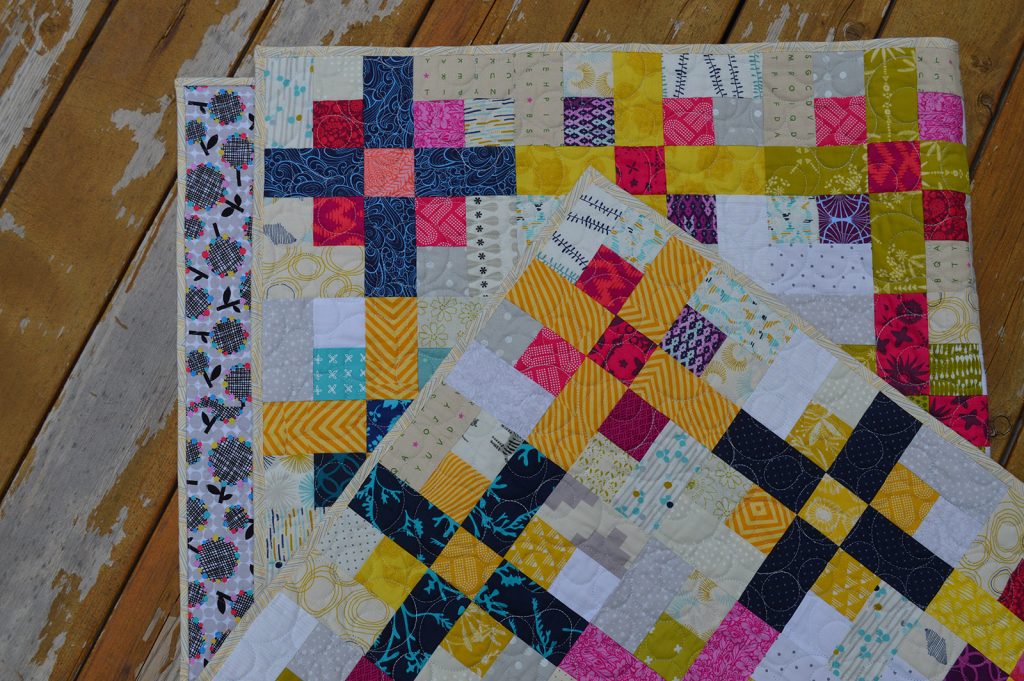 Nine Plus quilt by Sharon McConnell, scrappy modern nine-patch quilt