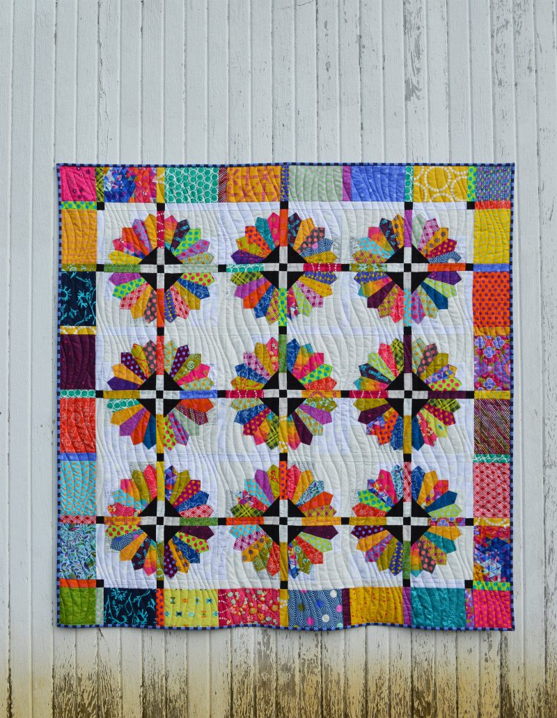 Daisy quilt pattern by Sharon McConnell, modern dresden scrappy bright quilt