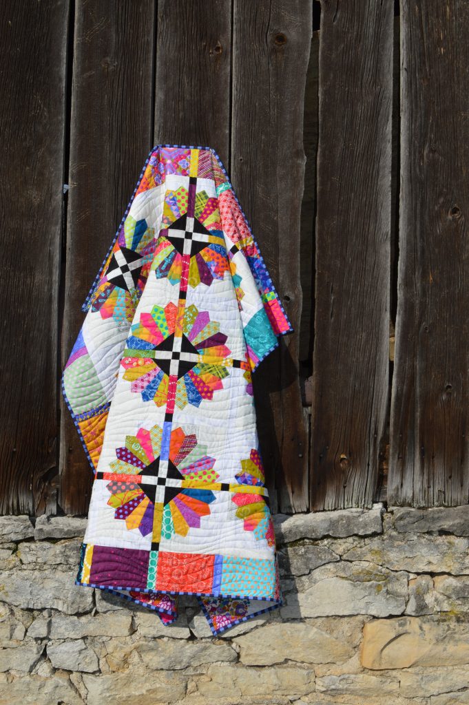 Daisy quilt pattern by Sharon McConnell, modern dresden scrappy bright quilt