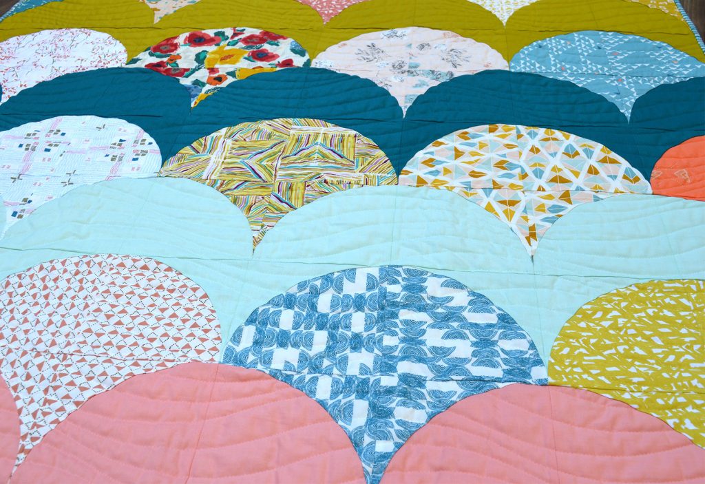 Mermaid quilt pattern by Color Girl quilts, with the Classic Curves Ruler, modern curved piecing quilt with Art Gallery Fabrics