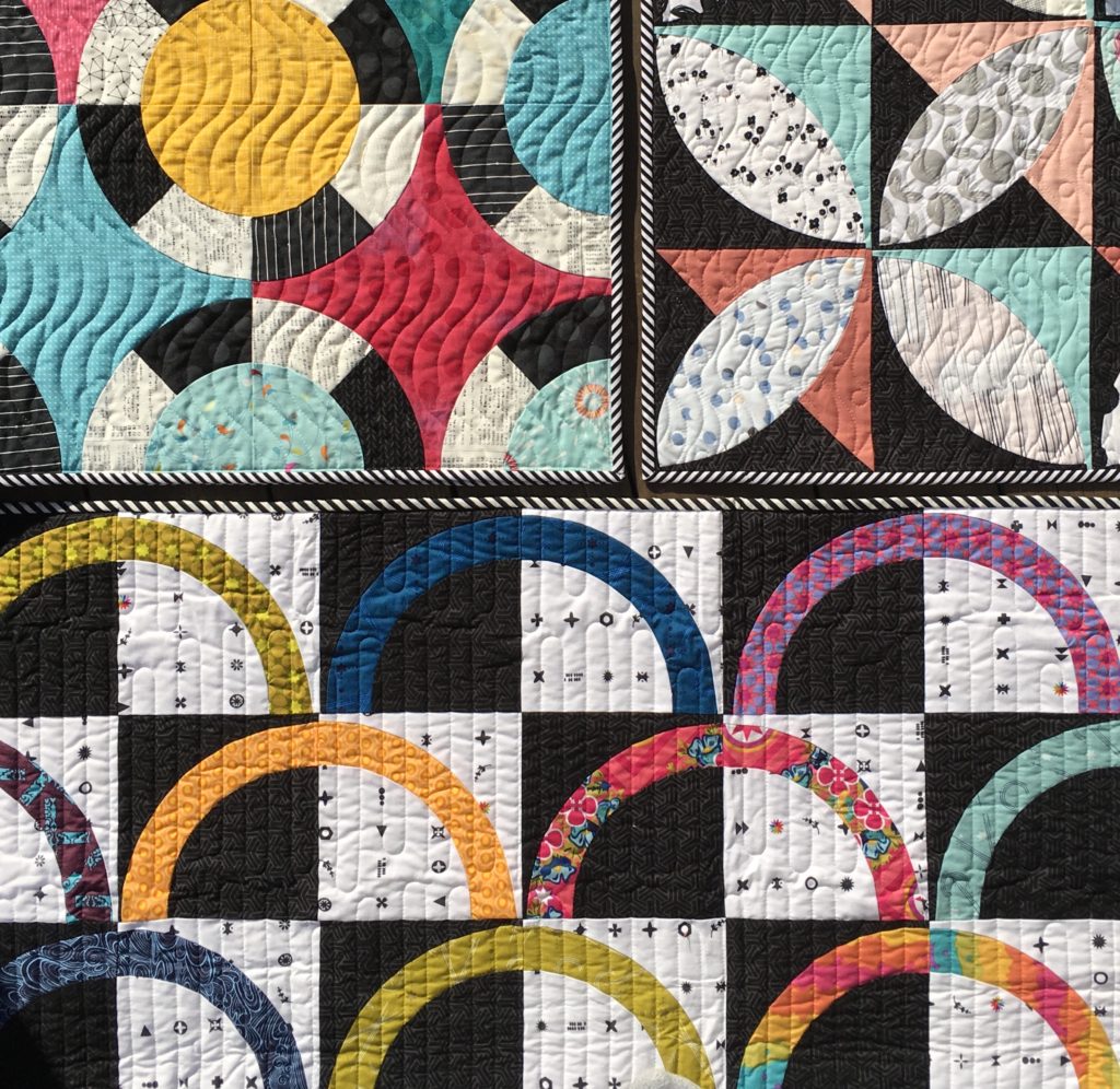 black and white quilts with bright colors by Sharon McConnell colorgirlquiltsblog.com modern quilts with curved piecing