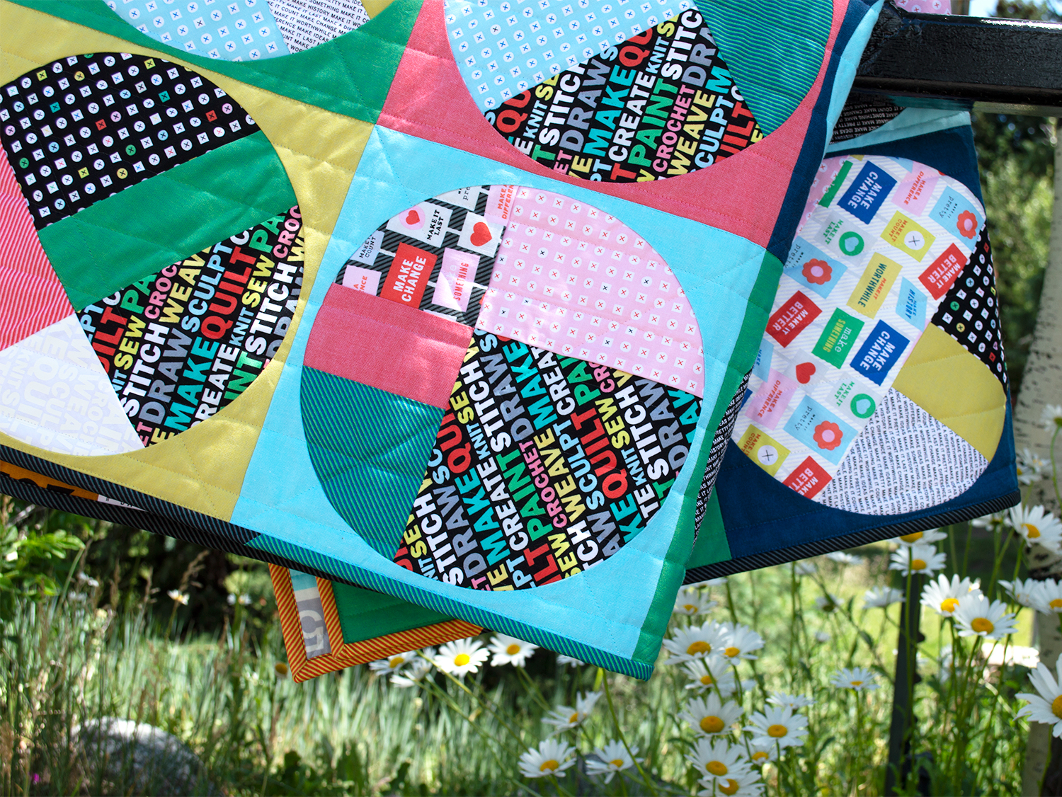 Uppercase fabrics by Windham Fabrics, scrappy circles quilt by Sharon McConnell