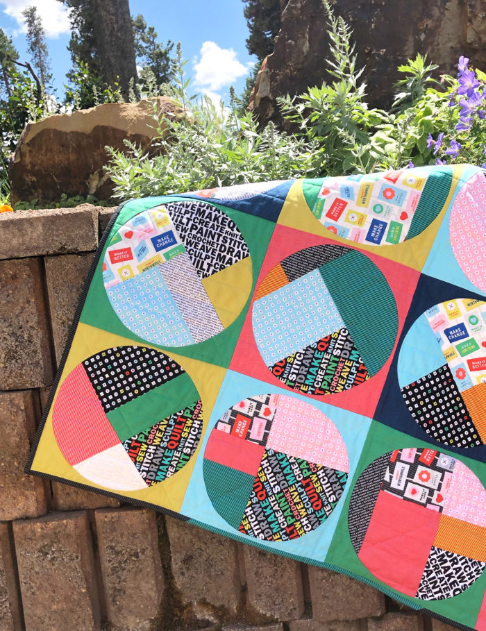 Uppercase fabrics by Windham Fabrics, scrappy circles quilt by Sharon McConnell