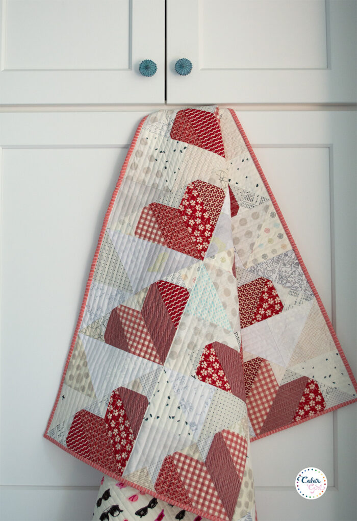 scrappy heart pieced quilt with scraps by Color Girl Quilts
